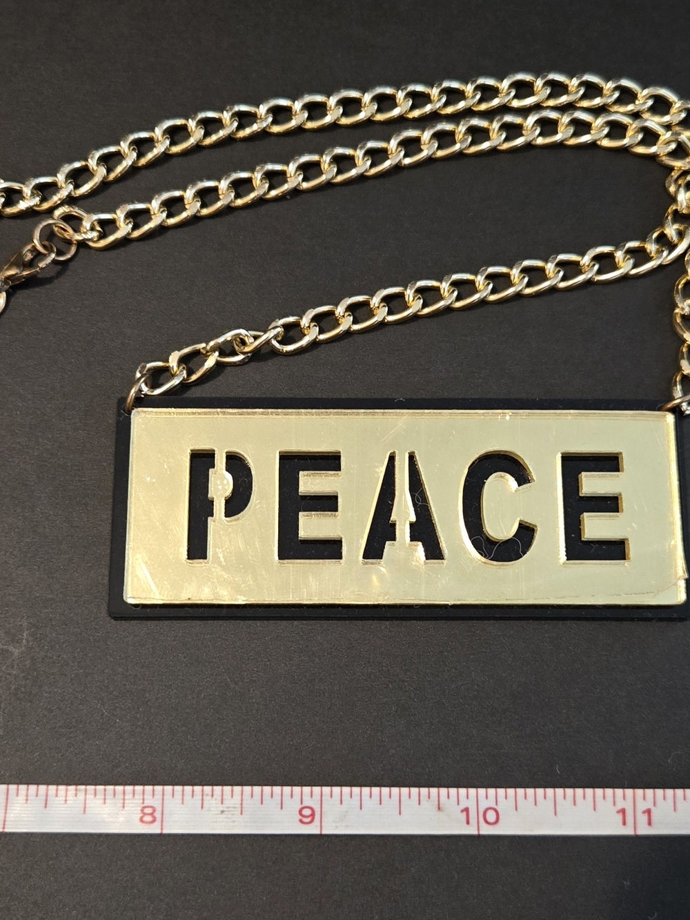 ✨ Gold-Tone "PEACE" Plaque Statement Costume Necklace